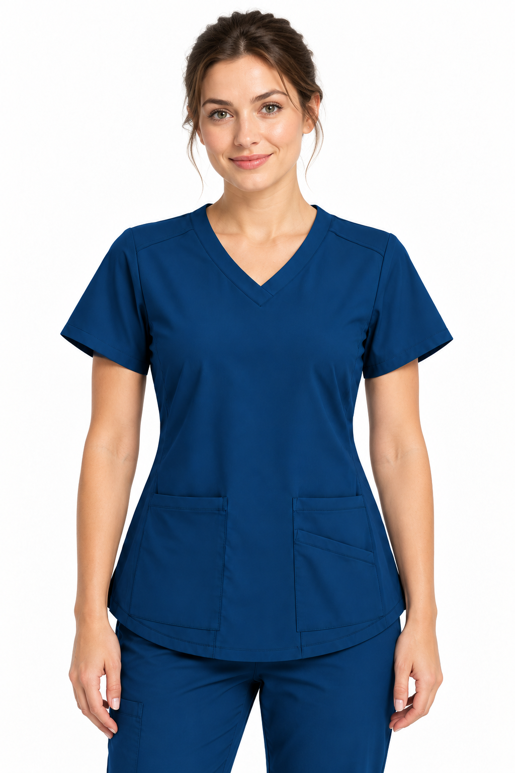 A woman modeling a short-sleeve V-neck scrub top and matching scrub pants in a solid navy blue color, photographed against a clean white background.
