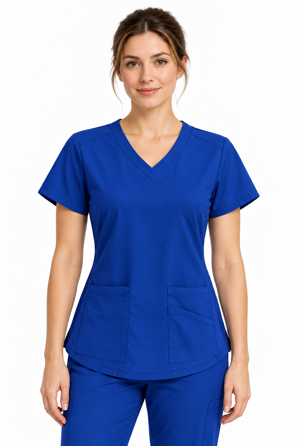 A woman wearing a royal blue V-neck scrub top and matching scrub pants, photographed against a plain white studio background.