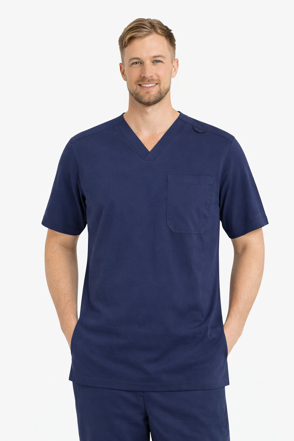 Man wearing a navy blue scrub top with a pocket on a white background