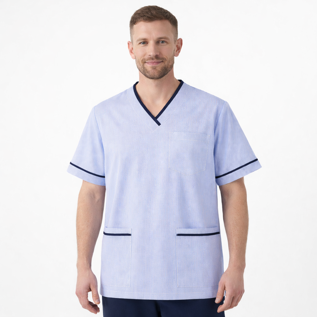 Man wearing a light blue scrub top with dark trim on a white background